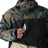 The 686 Geo Insulated Jacket 2025 is black with green and brown splotches, showcasing an insulated hood and a zippered front.