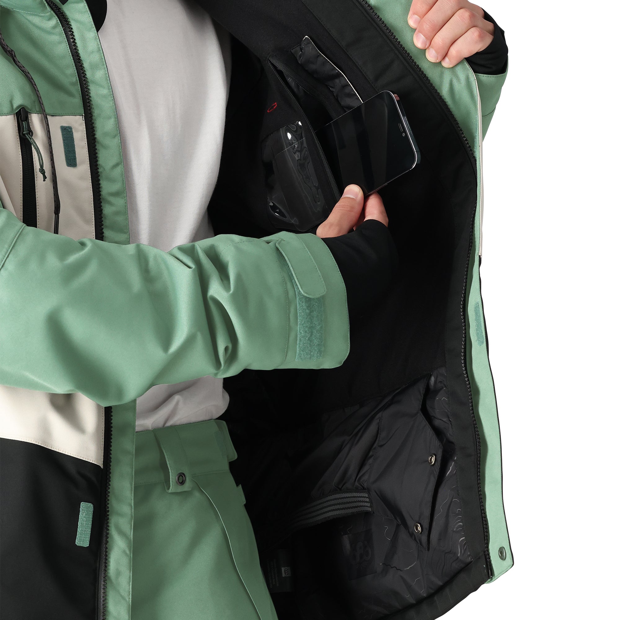 The 686 Geo Insulated Jacket 2025 is green with an insulated hood and zippered pockets.