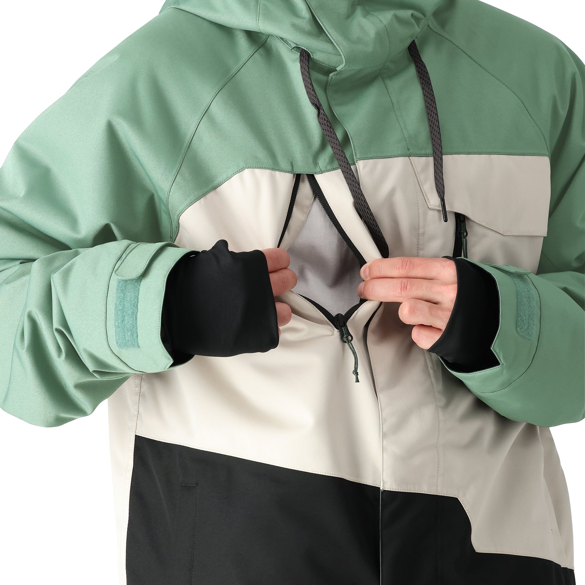 The 686 Geo Insulated Jacket 2025 has a predominantly green color scheme with a white panel on the front and black accents, featuring a drawstring hood and zippered pockets.