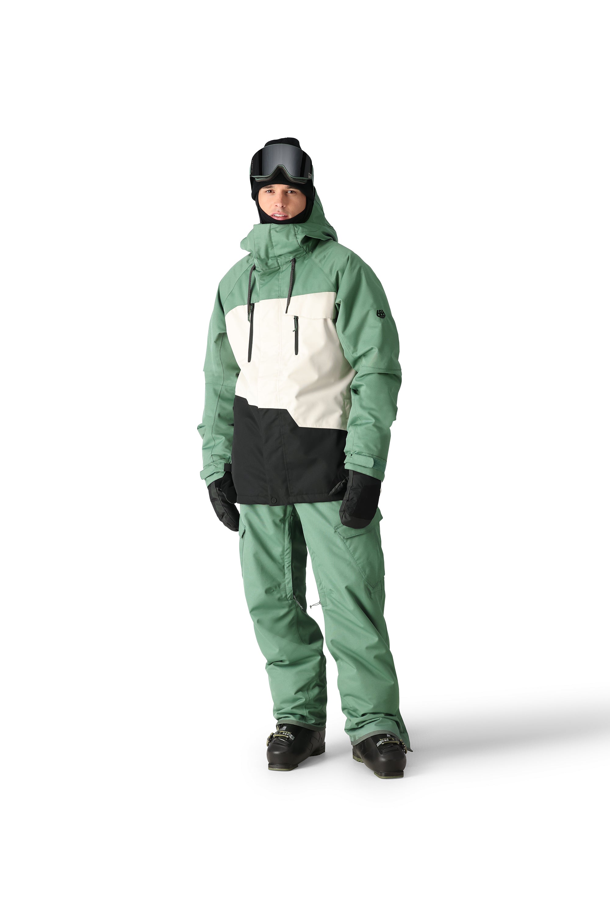 The 686 Geo Insulated Jacket 2025 is shown in this image from the front view, with a predominantly mint green color scheme and a white stripe across the chest.