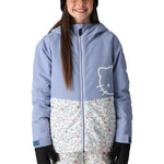The 686 Girl's Athena Insulated Jacket 2025 is primarily light blue with a white graphic on the front and has an insulated hood.