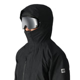 The 686 Gore-Tex Core Shell Jacket 2025 is black with a hood and a zipper that goes up to the chin.