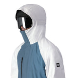 The 686 Gore-Tex Core Shell Jacket 2025 is predominantly white with blue and black accents on the front.