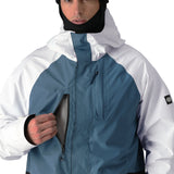 The 686 Gore-Tex Core Shell Jacket 2025 has a white front with blue detailing and black accents.