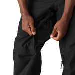 The 686 Men's GORE-TEX Core Shell Pant 2025 is black with a zippered fly and mesh vents on each leg.
