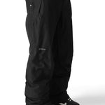 The 686 Men's GORE-TEX Core Shell Pant 2025 is black with a zippered pocket on the right thigh and a snap button closure at the waist.