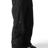 The 686 Men's GORE-TEX Core Shell Pant 2025 is black with a zippered pocket on the right thigh and a snap button closure at the waist.
