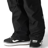 The 686 Men's GORE-TEX Core Shell Pant 2025 is primarily black with white logos and zippers.
