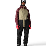The 686 Men's GORE-TEX Core Shell Pant 2025 in this image is black with a red stripe on the right leg.