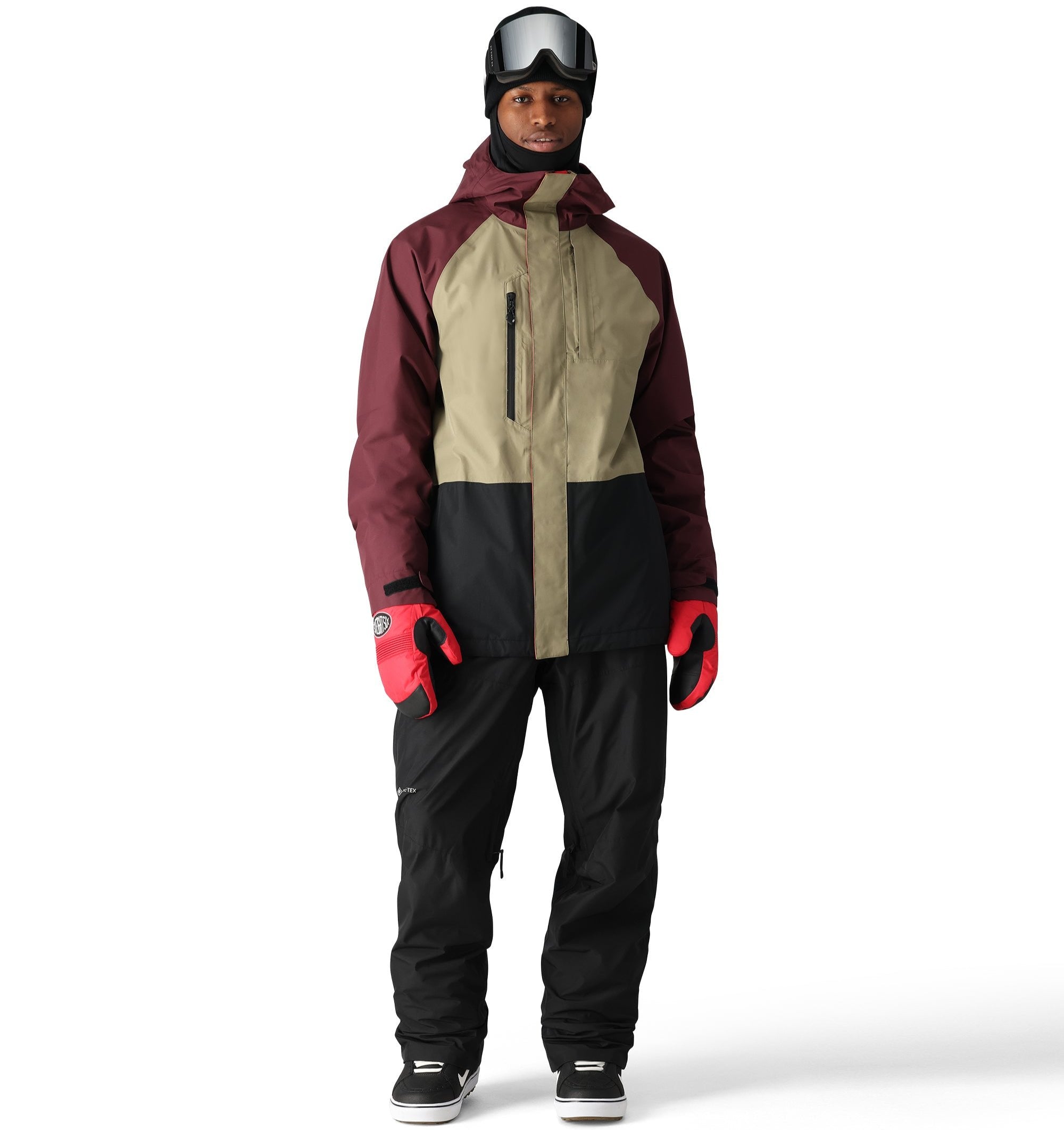 The 686 Men's GORE-TEX Core Shell Pant 2025 in this image is black with a red stripe on the right leg.