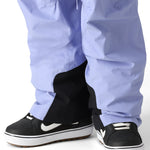 The 686 Men's GORE-TEX Core Shell Pant 2025 has a light purple color with black accents and a drawstring waist.