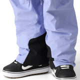 The 686 Men's GORE-TEX Core Shell Pant 2025 has a light purple color with black accents and a drawstring waist.