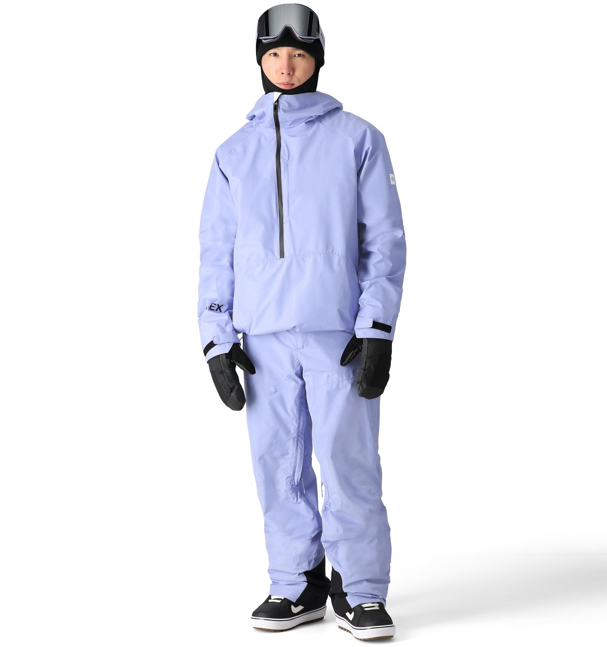 The 686 Men's GORE-TEX Core Shell Pant 2025 is light blue with a black zipper and two front zippered pockets.