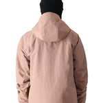 The 686 Gore-Tex GT Shell Jacket in tan has a hood and a prominent zippered front.