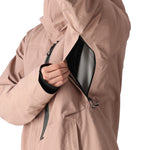 The 686 Gore-Tex GT shell jacket in salmon pink has a black zipper and an insulated hood.