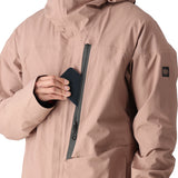 The 686 Gore-Tex GT shell jacket in light pink has an insulated hood and appears to be unzipped.