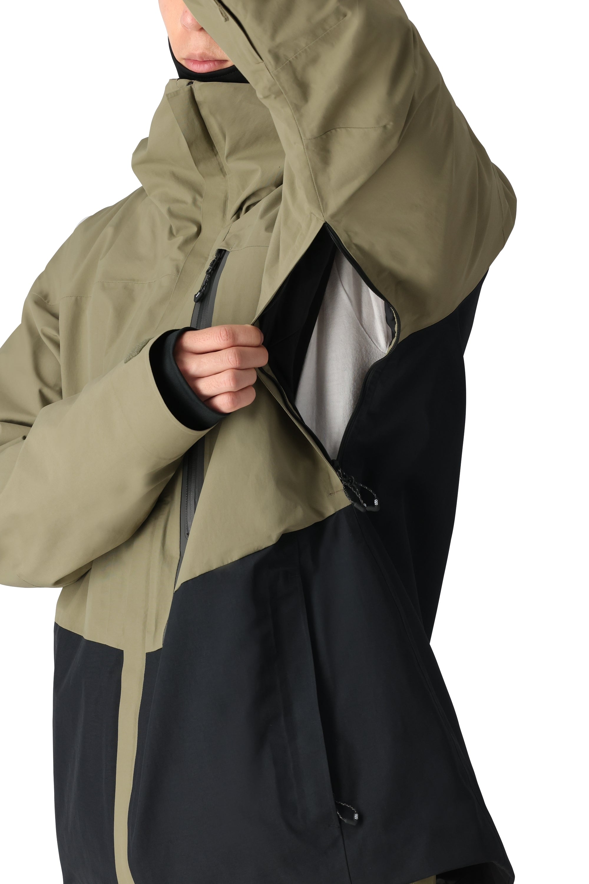 The 686 Gore-Tex GT Shell Jacket has a black and olive green color-block design with an insulated hood.