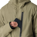 The 686 Gore-Tex GT Shell Jacket in khaki and black has an insulated hood.