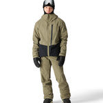 The 686 Gore-Tex GT Shell Jacket in olive green has a black BOA dial on the left sleeve and an insulated hood.