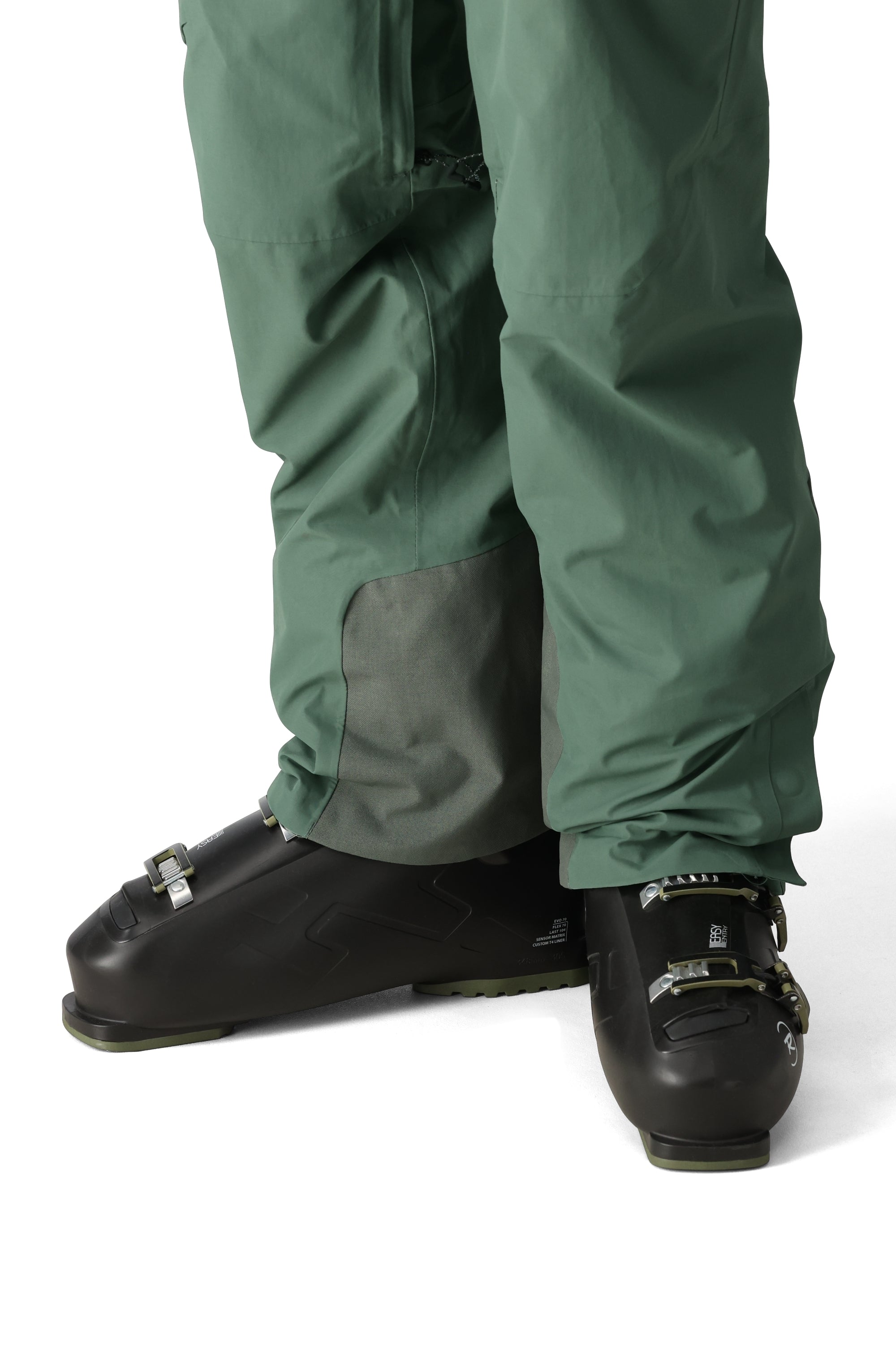 The 686 Men's GORE-TEX GT Pant 2025 appears in a front view with a dark green color and grey patch on the leg.