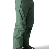 The 686 Men's GORE-TEX GT Pant 2025 in green has a zippered pocket on the leg and a black BOA dial.