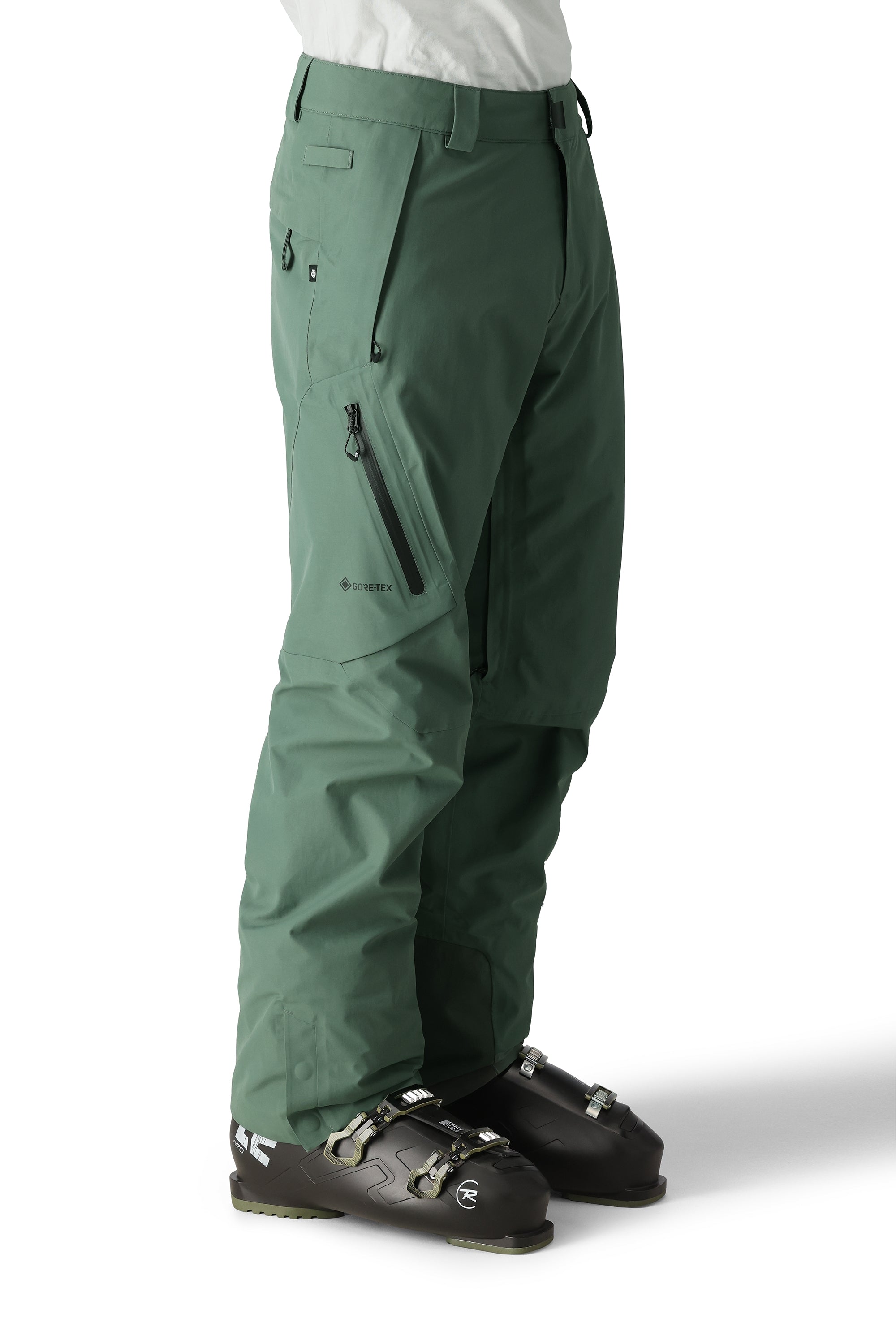 The 686 Men's GORE-TEX GT Pant 2025 in green has a zippered pocket on the leg and a black BOA dial.