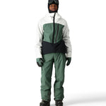 The 686 Men's GORE-TEX GT Pant 2025 is primarily white with green accents and black trim.