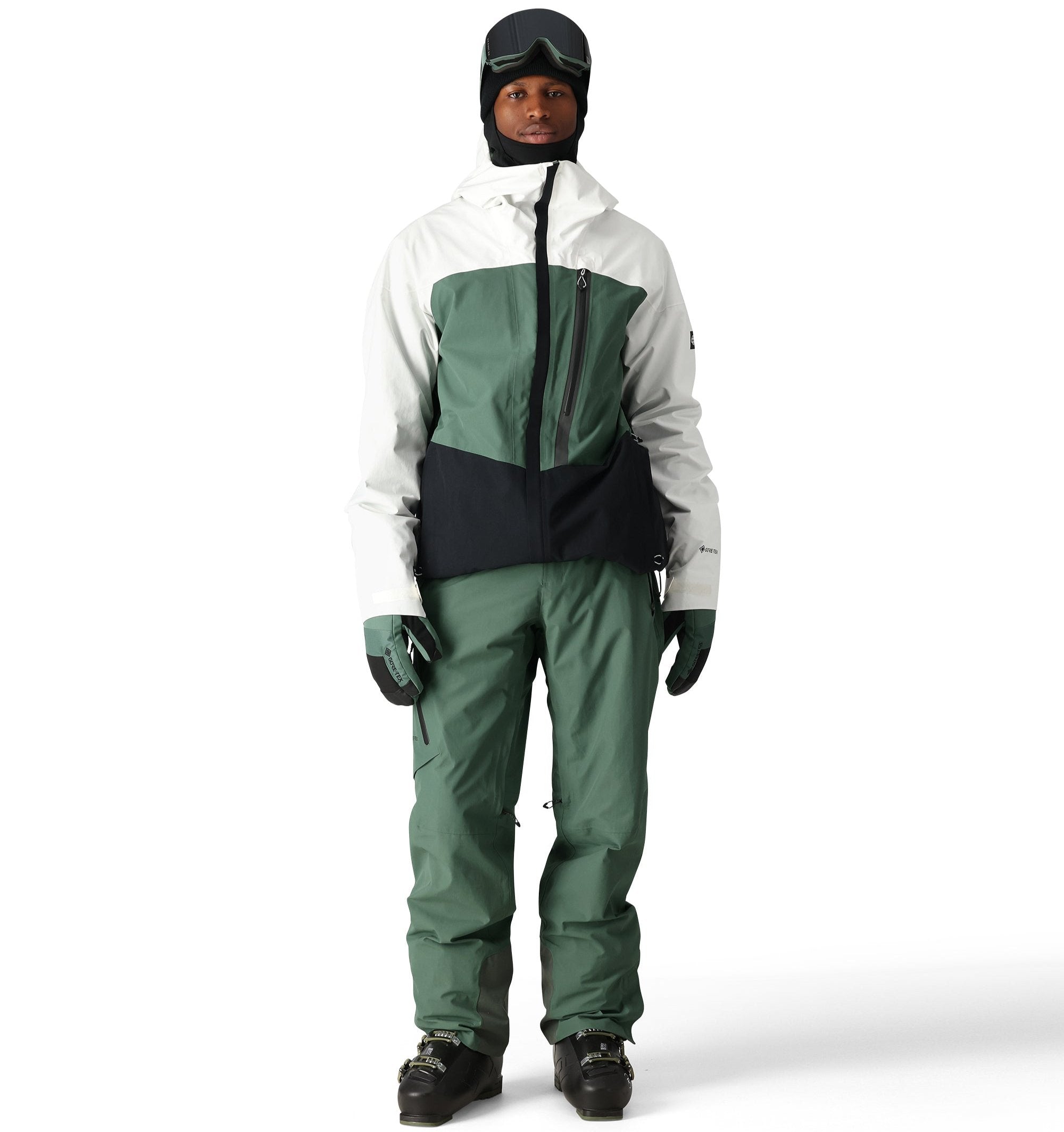 The 686 Men's GORE-TEX GT Pant 2025 is primarily white with green accents and black trim.