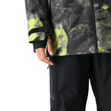 The 686 Gore-Tex Hydra Down Thermagraph jacket features a black body with bright green abstract designs and accents.