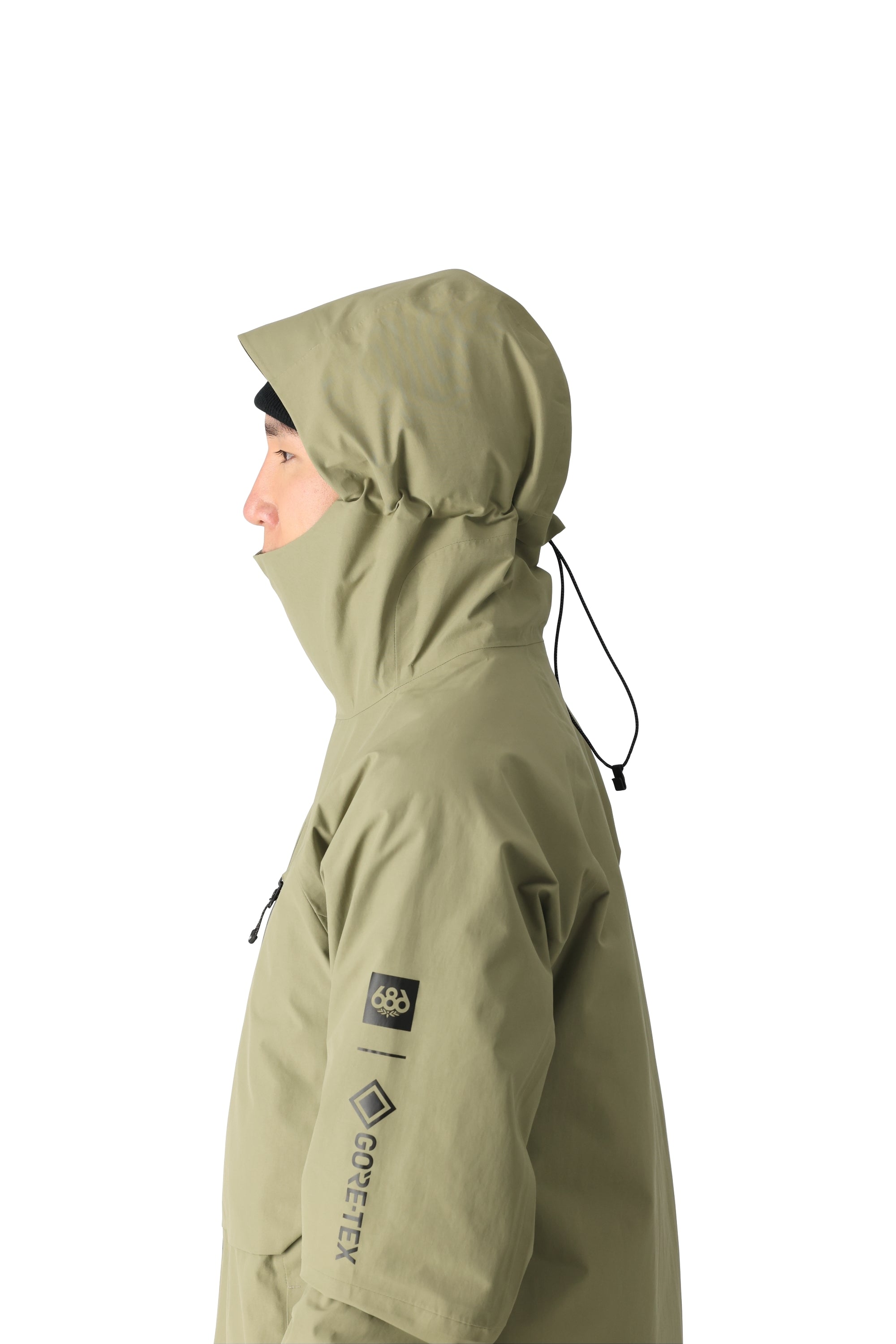 The 686 GORE-TEX Hydra Down Thermagraph Jacket has an olive green color with a hood and black drawstrings on both sides.