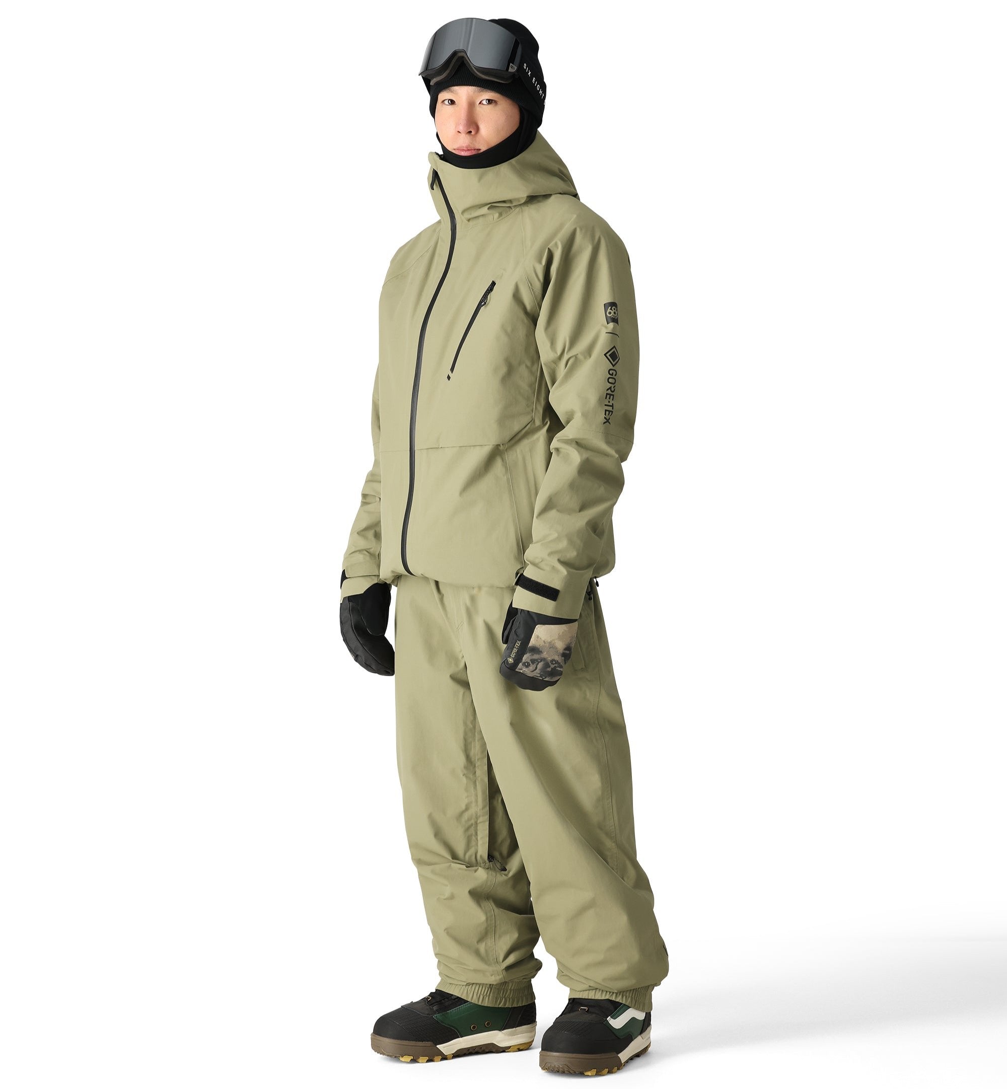 The 686 Gore-Tex Hydra Down Thermagraph jacket is primarily olive green with black accents and a visible zippered chest pocket.