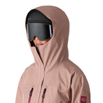 The 686 Women's GORE-TEX Skyline Shell Jacket 2025 is primarily a dusty rose color with rose-colored zipper pulls and a black BOA dial on the left side of the front, as seen from the chest down.