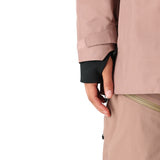 The 686 Women's GORE-TEX Skyline Shell Jacket 2025 is primarily tan with black accents and a zippered front.