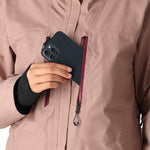 The 686 Women's GORE-TEX Skyline Shell Jacket 2025 is a dusty rose-colored jacket with a burgundy zipper and black drawstrings.