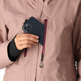 The 686 Women's GORE-TEX Skyline Shell Jacket 2025 is a dusty rose-colored jacket with a burgundy zipper and black drawstrings.
