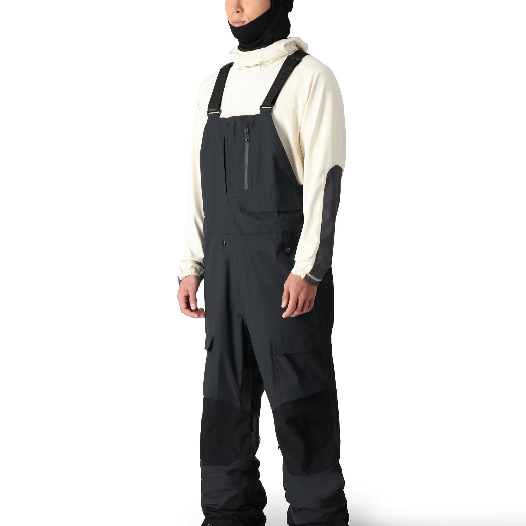 The 686 Men's GORE-TEX Stretch Dispatch Bib 2025 is depicted in black with a zippered chest pocket on the front view.