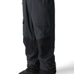 The 686 Men's GORE-TEX Stretch Dispatch Bib 2025 is black with a front view showcasing two zippered cargo pockets on each thigh.