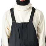 The 686 Men's GORE-TEX Stretch Dispatch Bib features a dark grey color with a zippered front and adjustable suspenders.