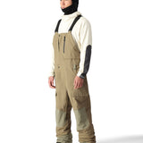 The 686 Men's GORE-TEX Stretch Dispatch Bib features khaki-colored fabric with black accents and a high-rise waistband.