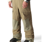 The 686 Men's GORE-TEX Stretch Dispatch Bib features a light brown color with tan accents and is shown in a front view.