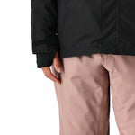 The 686 Women's GORE-TEX Willow Insulated Jacket 2025 is shown in black and pink, with a visible zipper at the waist.