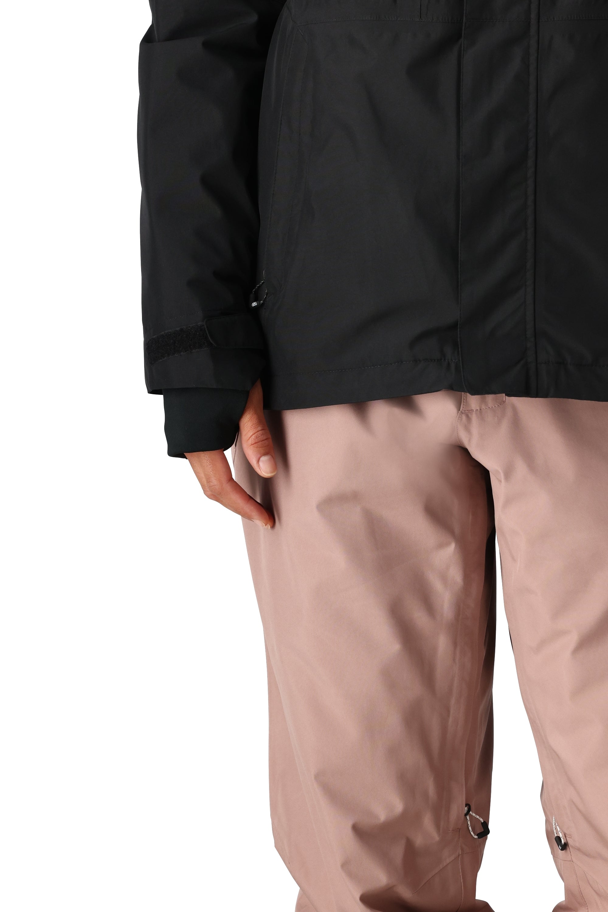 The 686 Women's GORE-TEX Willow Insulated Jacket 2025 is shown in black and pink, with a visible zipper at the waist.