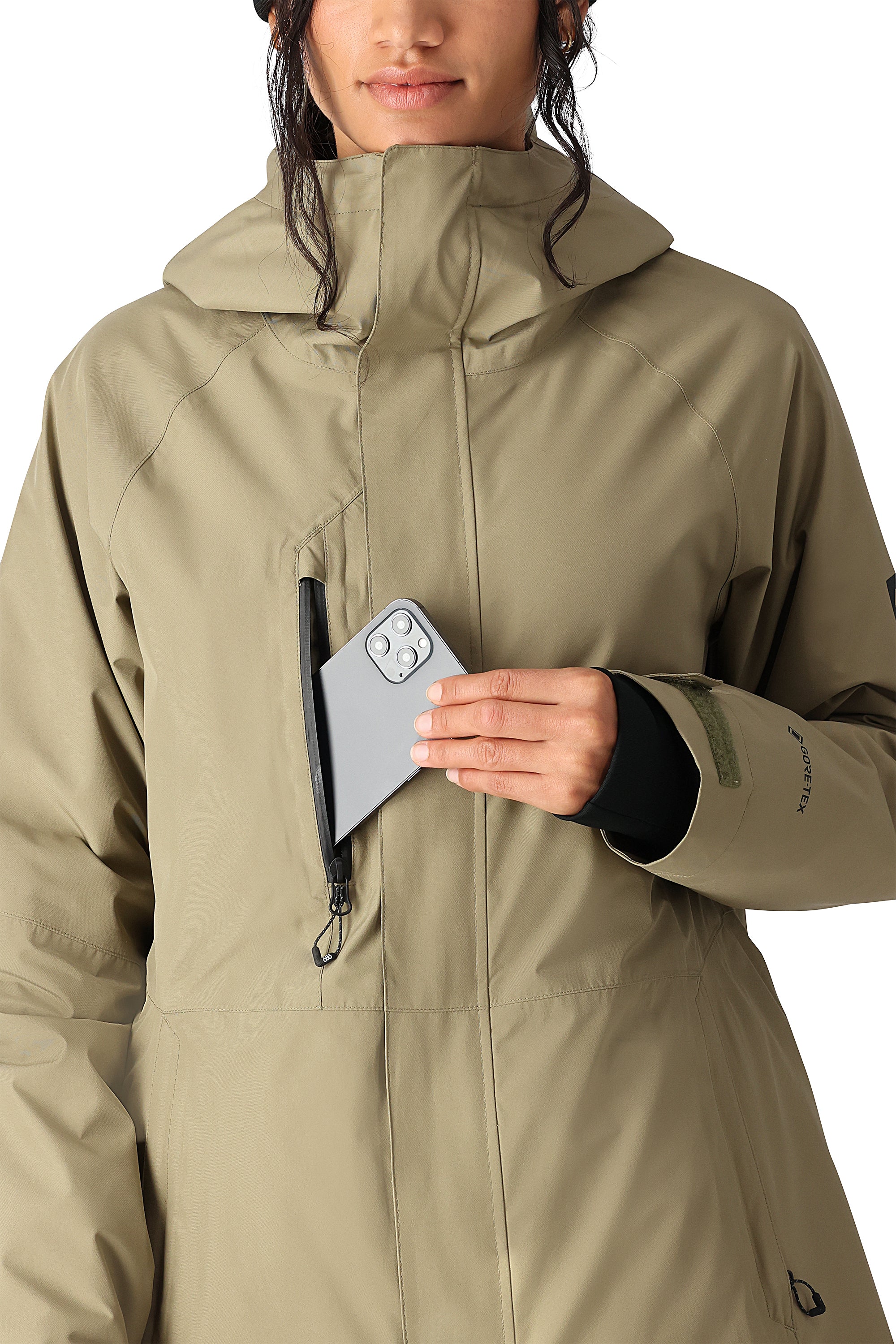 The 686 Women's GORE-TEX Willow Insulated Jacket 2025 is khaki with a high collar and an insulated hood.