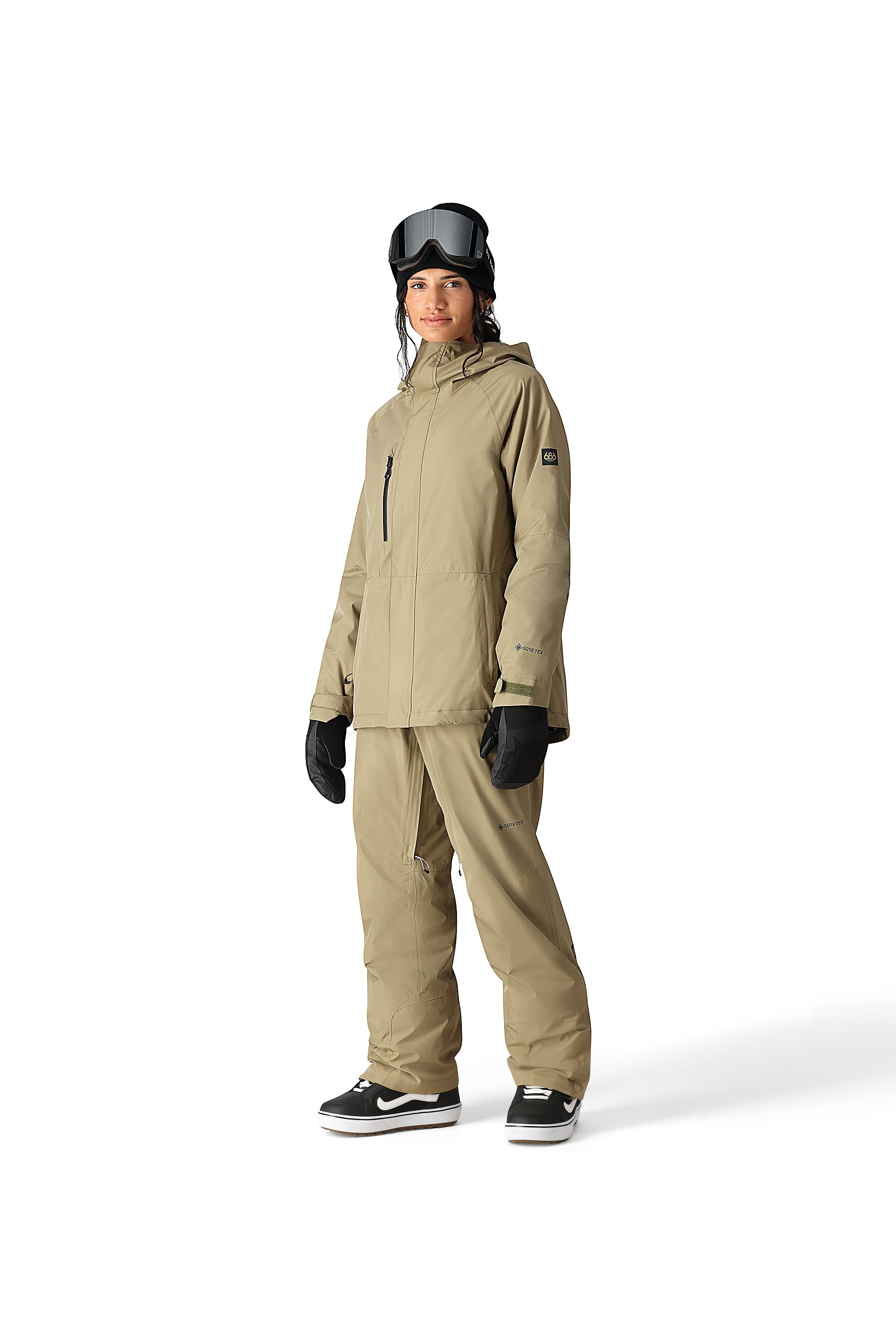 The 686 Willow insulated jacket has a tan color with a hood and front zipper.