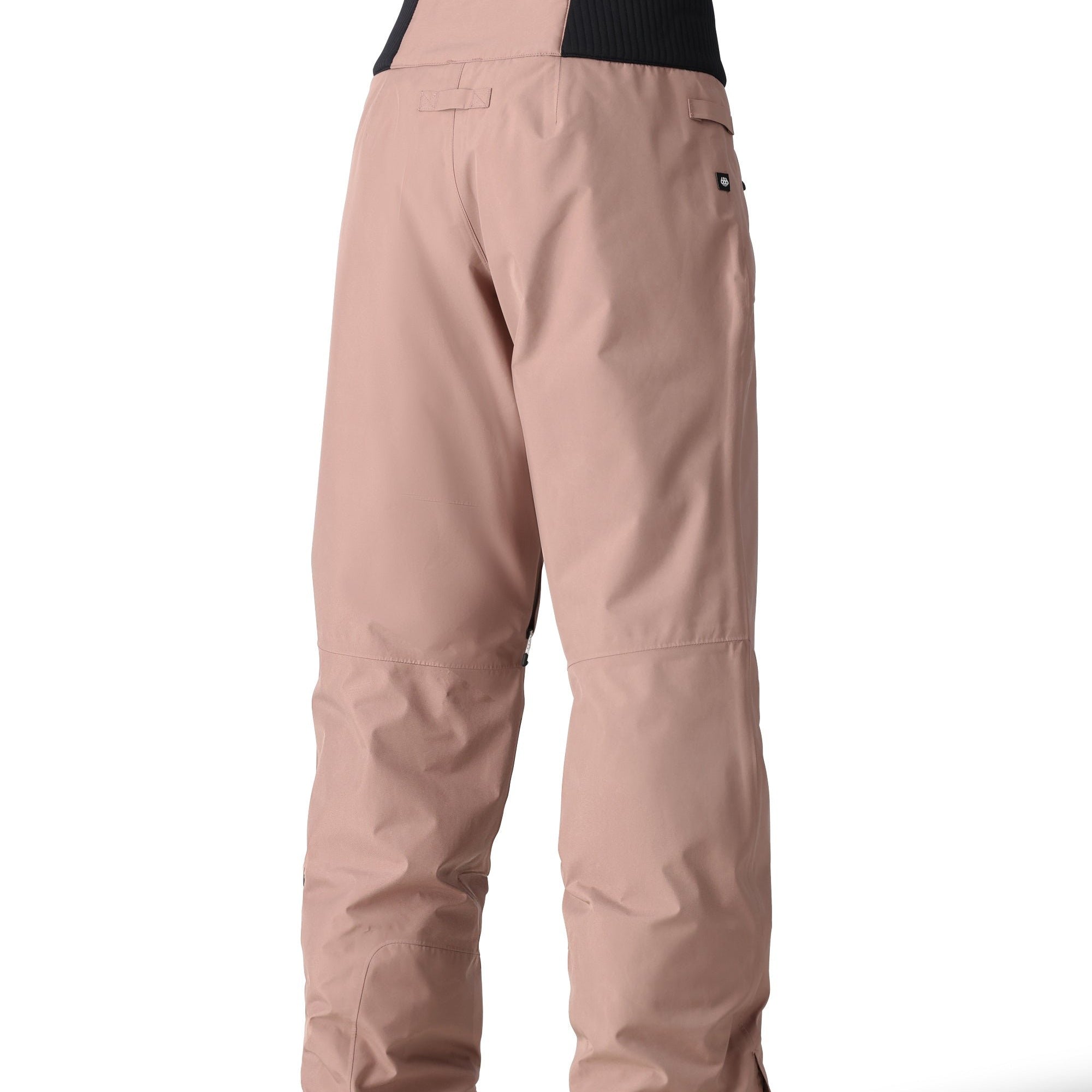 The 686 brand's Willow insulated pant has a black waistband and beige color.