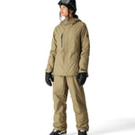 The 686 Women's GORE-TEX Willow Insulated Pant 2025 is khaki-colored with a zippered pocket on the right leg and side view.
