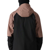 The 686 Hydra Thermagraph jacket in black and brown has an insulated hood with a zippered front closure.