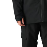 The 686 Hydra Thermagraph Jacket 2025 is black with a peach-colored stripe across the chest.
