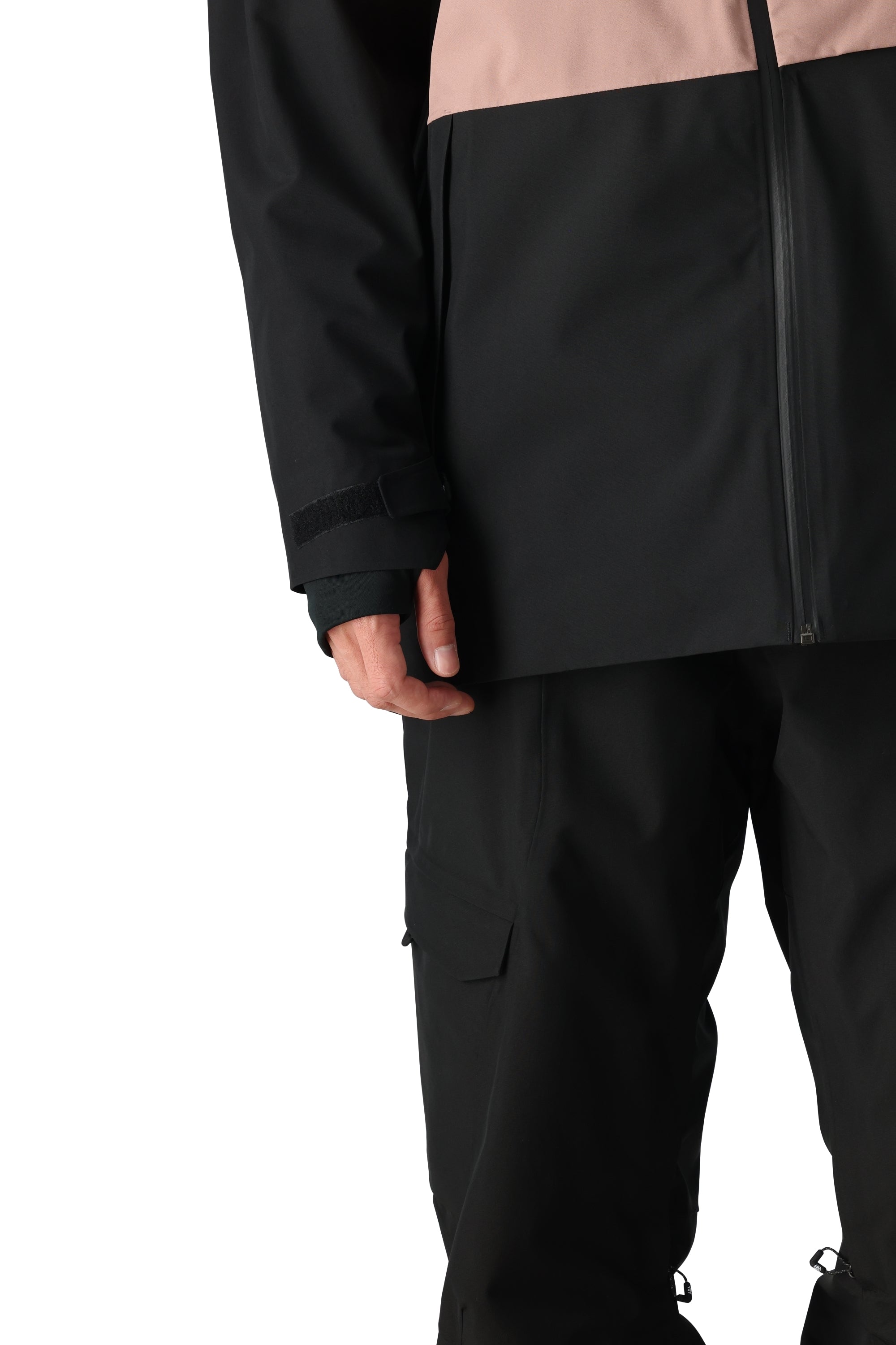 The 686 Hydra Thermagraph Jacket 2025 is black with a peach-colored stripe across the chest.