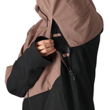 The 686 Hydra Thermagraph Jacket 2025 has a black and brown color scheme with an insulated hood, as seen in this front view.